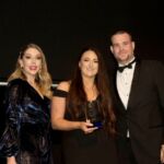 Beth Coundley from LGI Direct Sales wins the Advisor of the Year award from comedian Katherine Ryan (left) and sponsor Yolk Recruitment