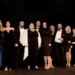 Conduit collect outsourced contact centre of the year award from comedian Katherine Ryan (left)