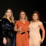 Danielle Nash from We Plan Group collects the Support Person of the Year award from comedian Katherine Ryan (left) and sponsor RWR Recruitment (right)