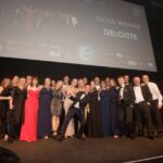 Deloitte collect shared service centre of the year award from comedian Katherine Ryan (one in from left)