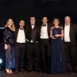 Deloitte pick up the Diverse Workforce award from comedian Katherine Ryan (left) and sponsor Legal & General Insurance