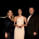 Elin Herbert from AA Driving School picks up the Trainer Coach of the Year award from Katherine Ryan and Ian Rothwell of headline sponsor RW Learning