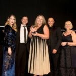 Elin Herbert from AA Driving School picks up the Trainer Coach of the Year award from Katherine Ryan and Ian Rothwell of headline sponsor RW Learning